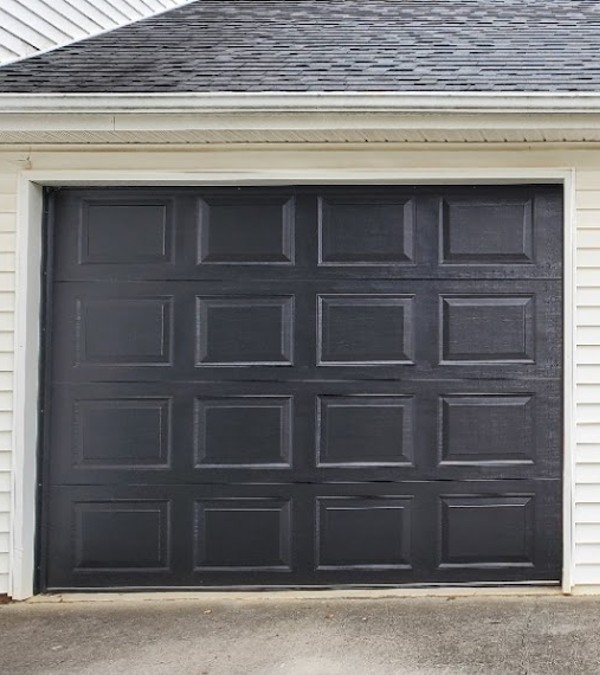 Black Garage Door on tan home