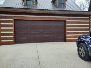 Residential Garage Door Install of an 18x8 model 64 gloss in the color brown by All American Garage Doors