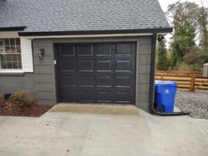 Residential Garage Door Installation of 9x7 model 65 gloss black retro fit by All American Garage Doors