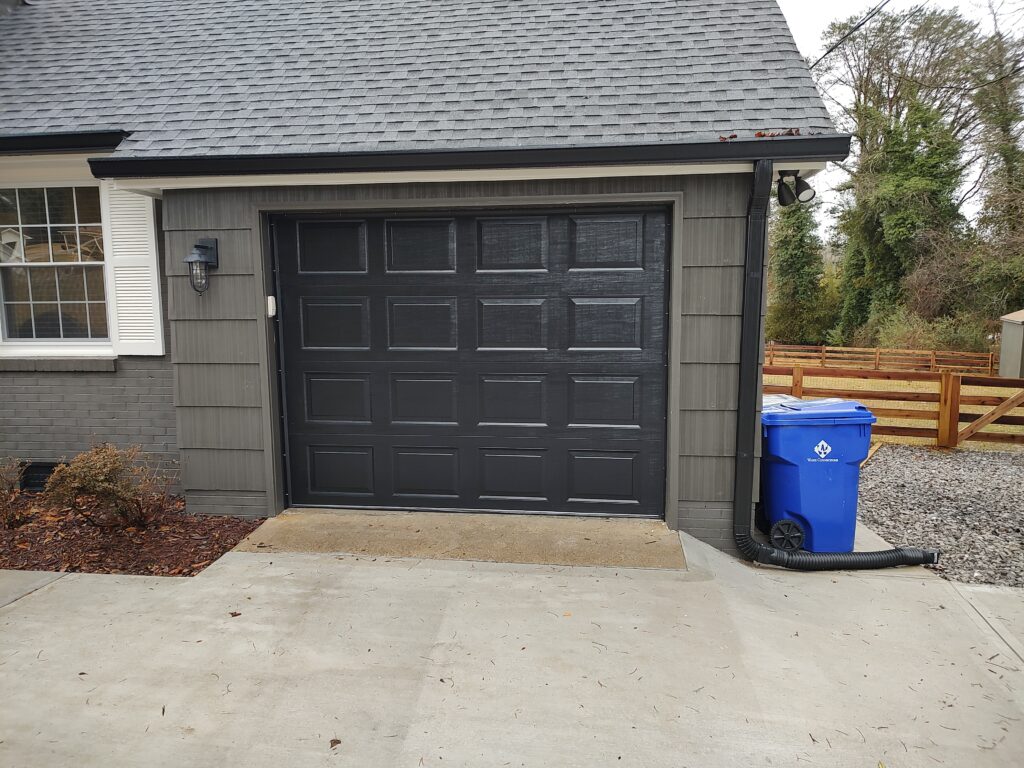 Residential Garage Door Installation of 9x7 model 65 gloss black retro fit by All American Garage Doors